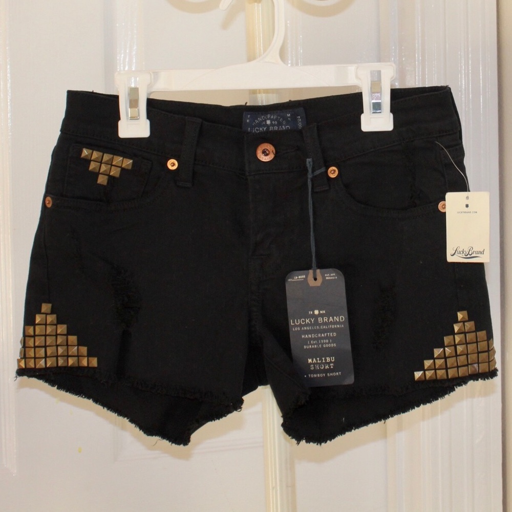 Black jean shorts with gold studs